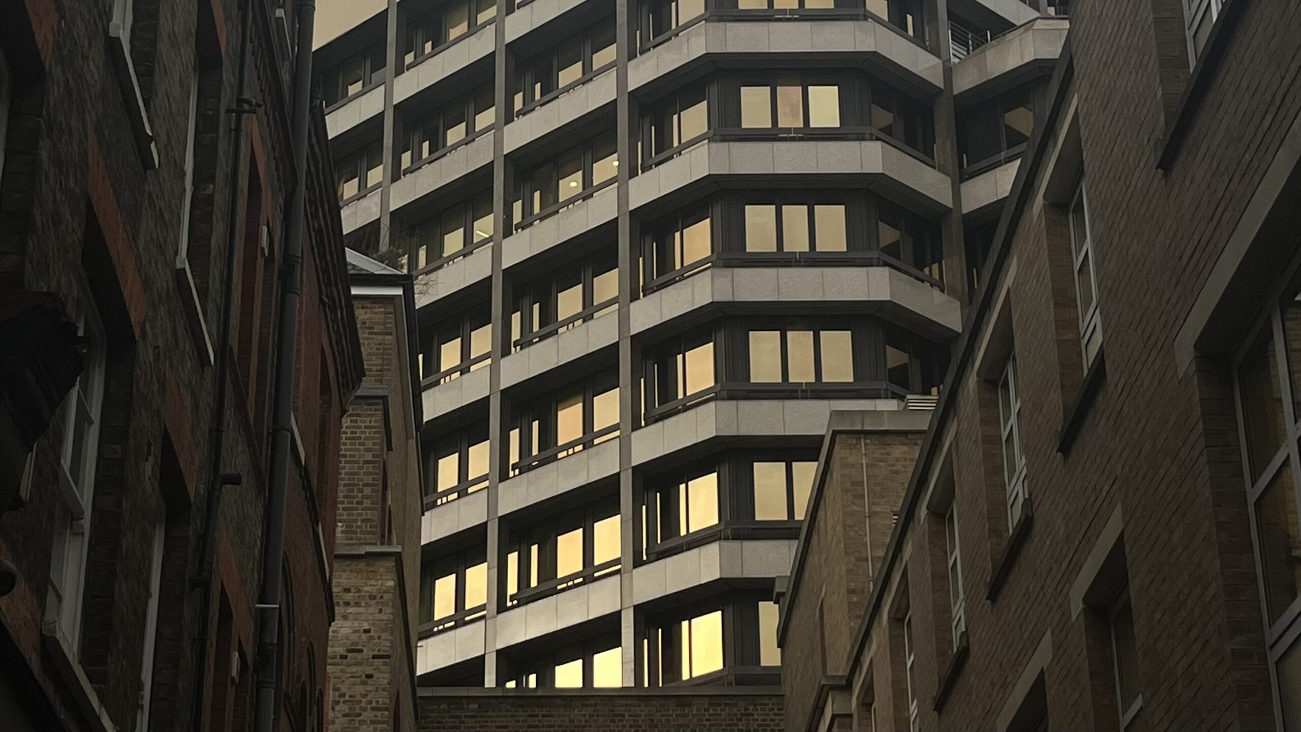 Green bedsheets in a small room